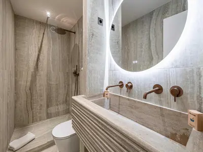 a bathroom with a tub and a toilet and a mirror at Elegant apartment - AC-4P - Cannes in Cannes