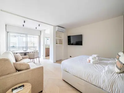 a living room with a bed and a couch at Elegant apartment - AC-4P - Cannes in Cannes