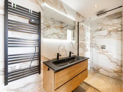 a bathroom with a sink and a shower at Modern flat with sea view - AC- 2BR- 4P - Cannes in Cannes