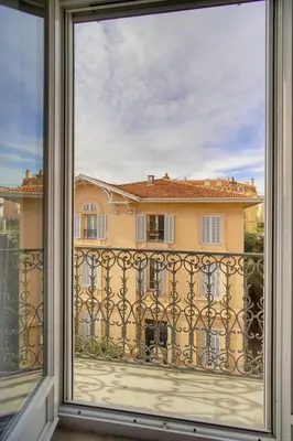 a window with a view of a building at Emily 2 bedrooms 2 baths near Palais in Cannes