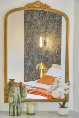 a bedroom with a large mirror on the wall at Emily 2 bedrooms 2 baths near Palais in Cannes