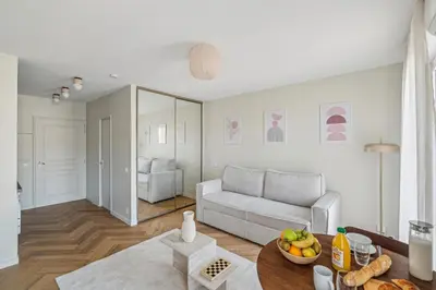 a living room with a couch and a table at Cozy Cannes in Cannes