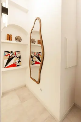 a dressing room with a mirror on the wall at Maison Azur-Townhouse Cannes Near Palais in Cannes