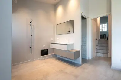 a bathroom with a sink and a mirror on the wall at Maison Azur-Townhouse Cannes Near Palais in Cannes