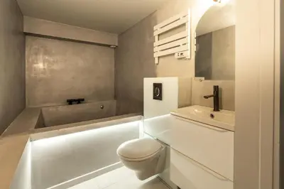 a bathroom with a toilet and a tub and a sink at Maison Azur-Townhouse Cannes Near Palais in Cannes