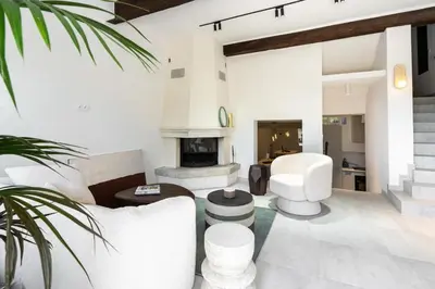 a living room with white furniture and a fireplace at Maison Azur-Townhouse Cannes Near Palais in Cannes
