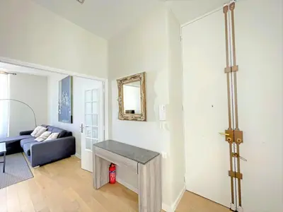 a living room with a couch and a table at IRIS APARTMENT backCroisette in Cannes
