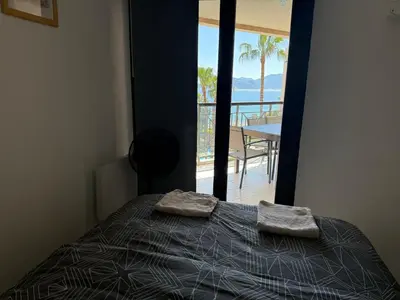 a bathroom with a blue sink and a toilet at a 2 minutes de la plage vue mer et piscine in Cannes