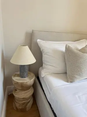 a lamp on a table next to a bed at Maison Dalaise - Cannes in Cannes