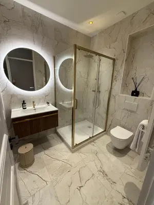 a bathroom with a shower and a toilet and a sink at Maison Dalaise - Cannes in Cannes