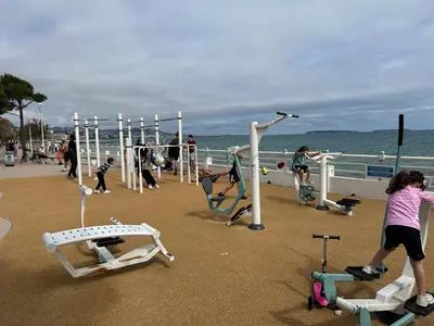 a group of children playing on a playground on the beach at Shiny Sea View Flat vue merTerrace in Cannes in Cannes
