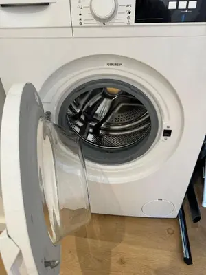 a white washing machine with its door open at Shiny Sea View Flat vue merTerrace in Cannes in Cannes
