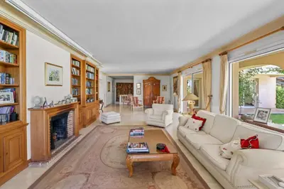 a living room with a couch and a fireplace at REF 1849 - Cannes - Villa Provencal Style to rent in Le Cannet