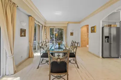a dining room with a glass table and chairs at REF 1849 - Cannes - Villa Provencal Style to rent in Le Cannet