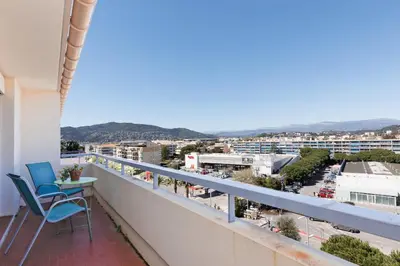 a balcony with a view of a city at Appartement lumineux Cannes proche mer in Cannes