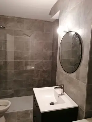 a bathroom with a sink and a mirror and a toilet at St Paul Cannes in Cannes