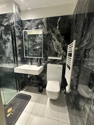 a bathroom with a toilet and a sink at Villa carré des musiciens in Cannes