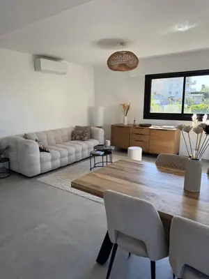 a living room with a couch and a table at Kazanou in Cannes