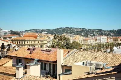a view of a city with roofs and buildings at Alma Apart Residence in Cannes