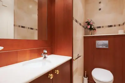 a bathroom with a sink and a toilet and a mirror at Fettolina YourHostHelper in Cannes