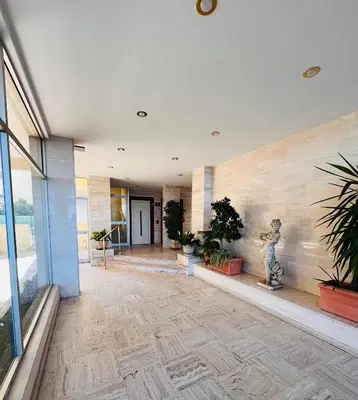 a hallway with potted plants in a building at Cannes Palm Beach - Brand New Studio - Oasis of Calm in Cannes