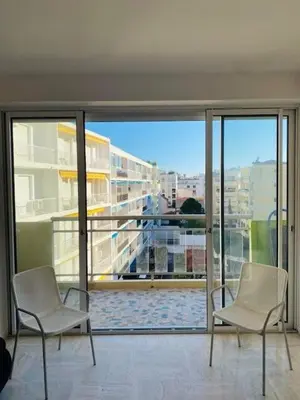 two chairs in a room with a view of a city at Cannes Palm Beach - Brand New Studio - Oasis of Calm in Cannes