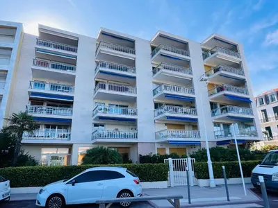 a white car parked in front of a building at Cannes Palm Beach - Brand New Studio - Oasis of Calm in Cannes