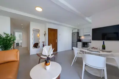 a living room with a couch and a table at 2-Br Apartment Terrace Cannes City Centre in Cannes