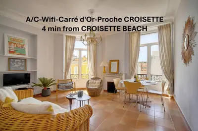 a living room with a couch and a table at Lumineux 2 chambres, CARRE D'OR-COEUR DE CANNES A2B196 in Cannes