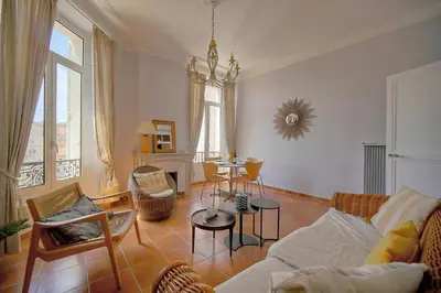 a living room with a couch and a table at Lumineux 2 chambres, CARRE D'OR-COEUR DE CANNES A2B196 in Cannes