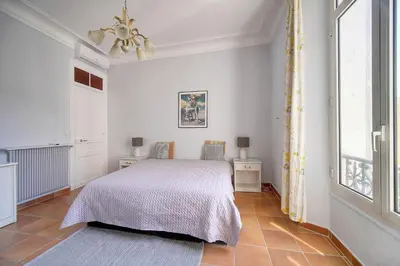a white bedroom with a bed and a window at Lumineux 2 chambres, CARRE D'OR-COEUR DE CANNES A2B196 in Cannes