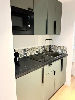 a kitchen with a sink and a microwave at Studio Neuf Clim 4p - Cannes in Cannes
