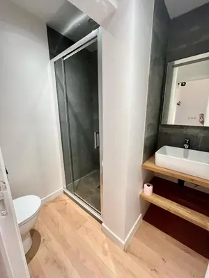 a bathroom with a shower and a toilet and a sink at Studio Neuf Clim 4p - Cannes in Cannes
