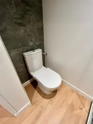 a bathroom with a white toilet in a room at Studio Neuf Clim 4p - Cannes in Cannes