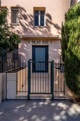a gate in front of a palias rouse building at LE MADRID avec balcon proche Croisette plages et Palais des Festivals in Cannes