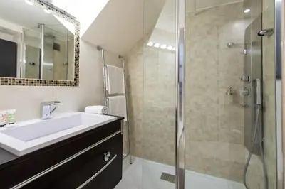 a bathroom with a sink and a shower at LE RIMBAUD splendide duplex dans le Suquet, près des plages et du Palais des Festivals in Cannes