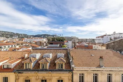 a view of a city with roofs and buildings at LE VANILLE studio cosy au cœur de la Banane in Cannes