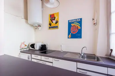a kitchen with a sink and a counter top at LE RÉTRO studio avec mezzanine en plein centre in Cannes