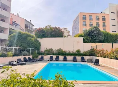 a swimming pool on the roof of a building at Duplex centre de Cannes - terrasse, sunset & pool in Cannes