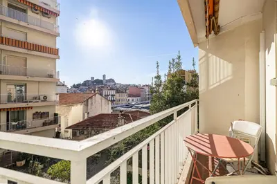 a balcony with a view of a city at LE LOUIS BLANC avec balcon en plein centre-ville in Cannes