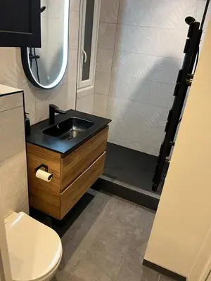 a bathroom with a sink and a shower at Stylish Central Cannes Apartment in Cannes