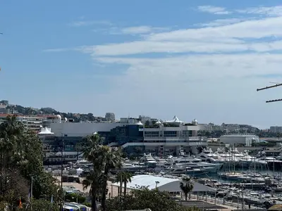 a view of a harbor with boats in a city at 2 Bedrooms sea view in Le Suquet in Cannes
