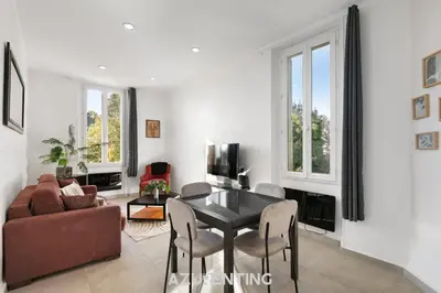 a bedroom with a bed in a white room at Azurenting - Bastide Oliva - 1 chambre - Balcon in Cannes