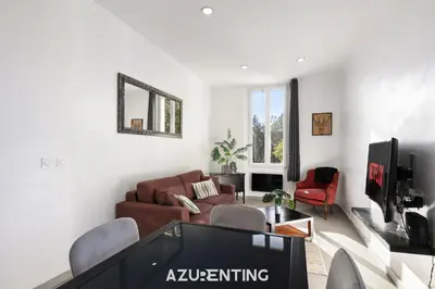 a bedroom with a door open to a balcony at Azurenting - Bastide Oliva - 1 chambre - Balcon in Cannes