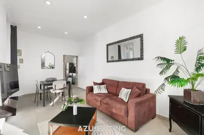 a balcony with a wrought iron railing and trees at Azurenting - Bastide Oliva - 1 chambre - Balcon in Cannes