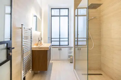 a bathroom with a sink and a shower at Le 121 - LOFT design Rue d'Antibes in Cannes