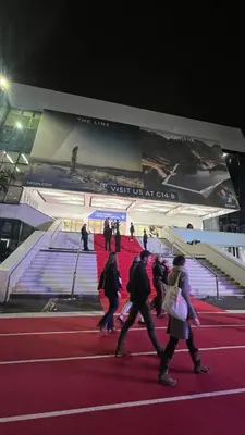 a group of people walking on a red carpet in front of a building at Cannes Center, minutes walk from the Palais des festivals, Beaches, La Croisette and Rue d'Antibes in Cannes
