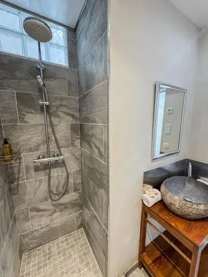 a bathroom with a shower and a sink at RED DOOR Forville Market View in Cannes