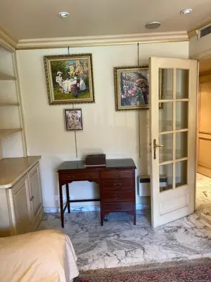 a bedroom with a desk and a bed at La Palme studio in Cannes