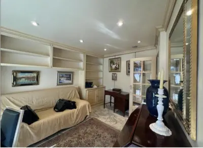 a living room with a couch and a table at La Palme studio in Cannes